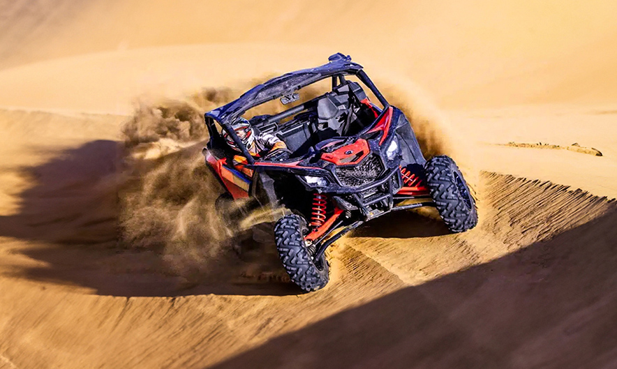 Guest driving CANAM X3 buggy over the dunes